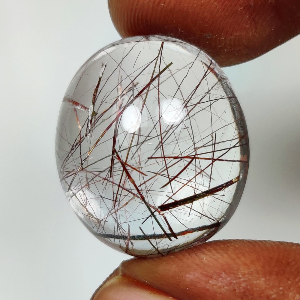 29.21 Ct Natural Rutile Quartz Oval Cab: Weight - 29.21 Ct / Dimensions - 21.10 x 18.40 x 11.10 mm / Shape & Cut - Oval Cab / Transparency - Transaprent / Origin - Norway / Comments - None