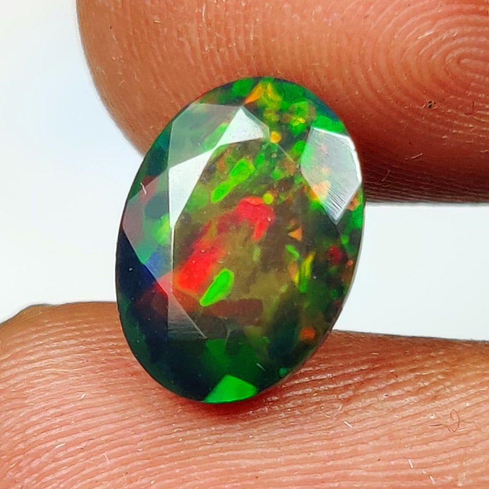 2.04 Ct Natural Black Flashing Fire Opal Oval cut (1 of 2)