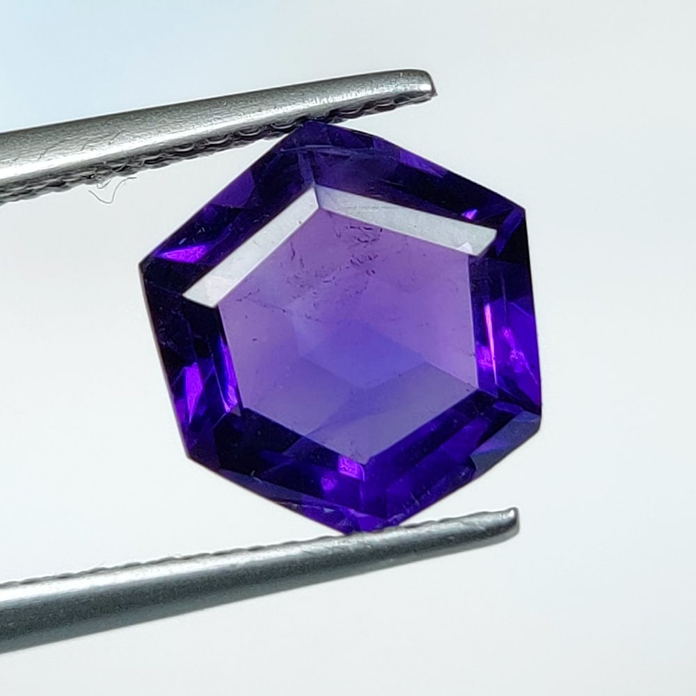 2.90 Ct Natural Purple Amethyst Hexagon Cut: Weight - 2.90 Ct / Dimensions - 10.40 x 9.60 x 5.40 mm / Shape - Hexa Cut / Color - Purple / Clarity - Transparent / Origin - Brazil / Treatment - Heated