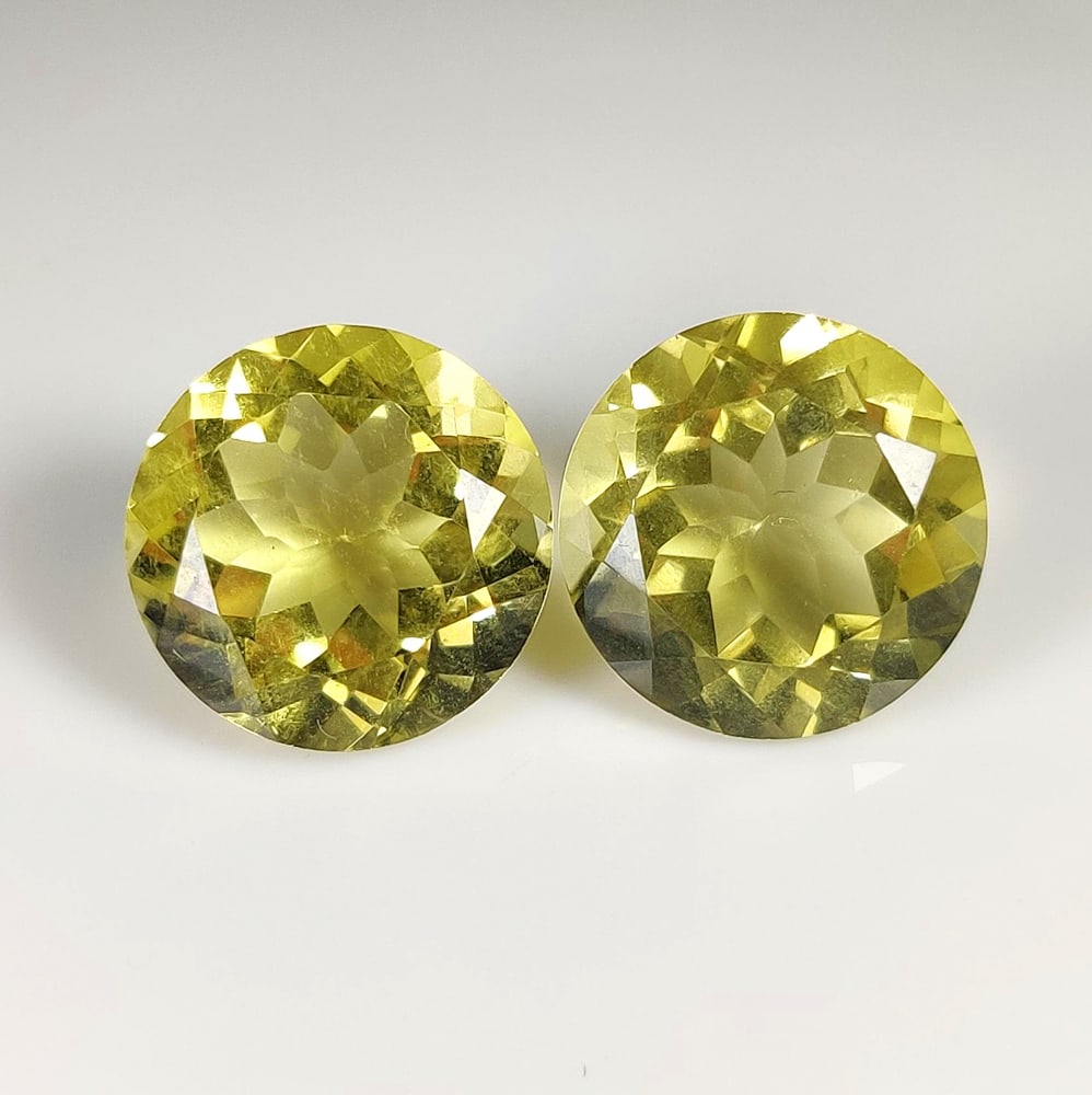 28.07 Ct Natural Lemon Quartz Round Cut Pair: Weight - 28.07 Ct / Dimensions - 16.20 x 16.20 x 10.00 mm / 2 Pc's / Top Quality Luster / Excellent Round Cut / Origin - Brazil / Comments - Heated