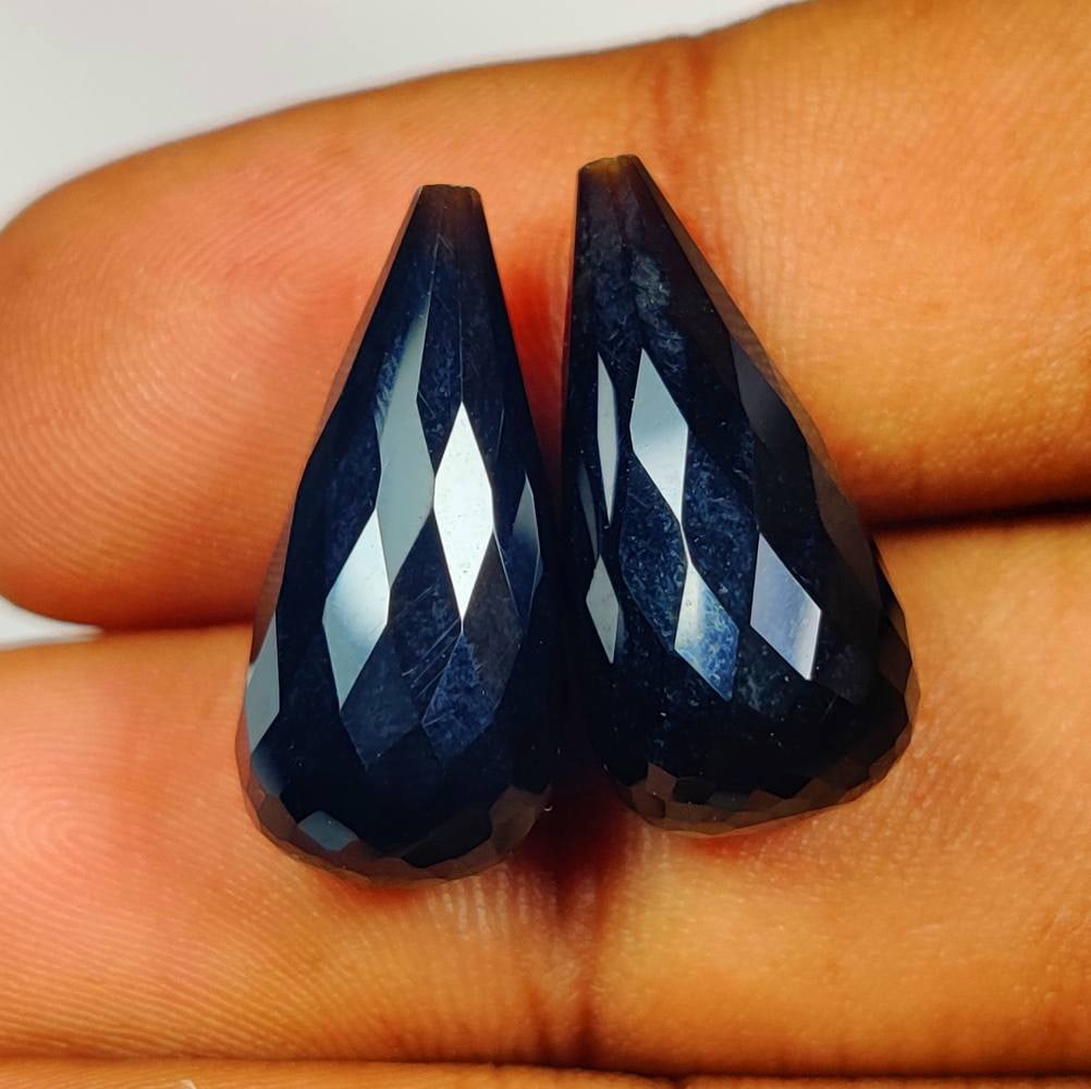 21.65 Ct Natural Black Onyx Fancy Pear Drop Pair: Weight - 21.65 Ct / Dimensions - 20.10 x 9.60 x 9.60 mm / 2 Pc's / Shape - Fancy Pear Drop / Clarity - Opaque / Origin - Brazil / Treatment - None