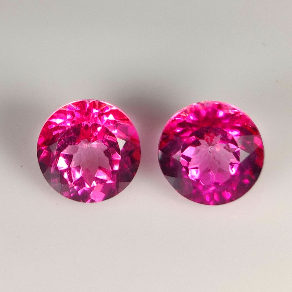 9.71 Ct Natural Pink Topaz Round Cut Pair: Weight - 9.71 Ct / Size - 10.10 x 10.10 x 6.90 mm / 2 Pc's / Shape - Round Cut / Color - Pink / Clarity - VVS / Origin - Brazil / Treatment - Color Coated