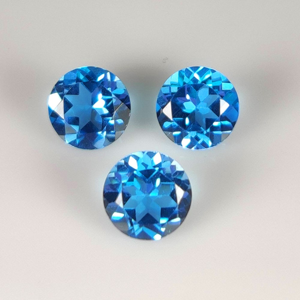 5.16 Ct Natural Blue Topaz Round Cut Set: Weight - 5.16 Ct / Dimensions -7.10 x 7.10 mm / 3 Pc's / Shape - Round Cut / Color - Blue / Clarity - VVS / Origin - Brazil / Treatment - Irradiated