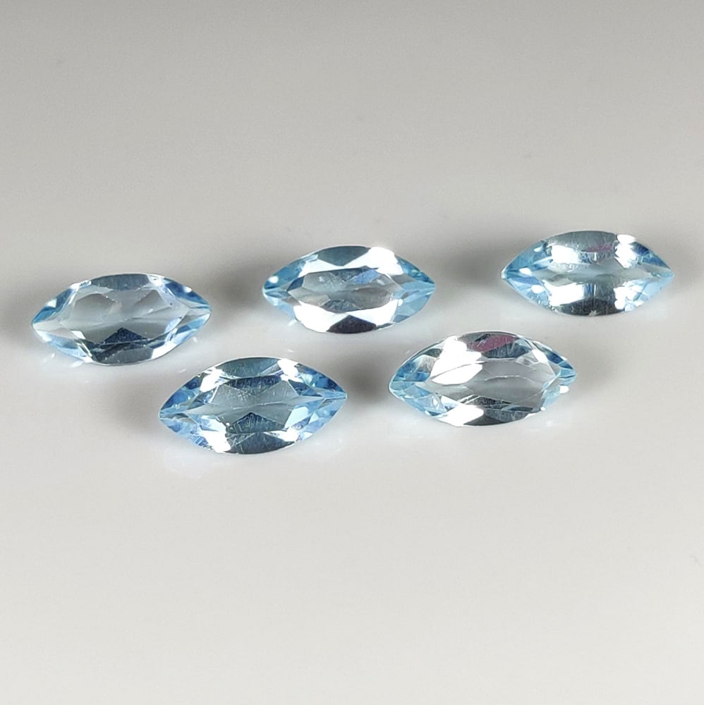 5.65 Ct Natural Blue Topaz Marquise Cut Set: Weight - 5.65 Ct / Dimensions - 10.0x5.0 - 10.1x5.1 mm / 5 Pc's / Shape - Marquise Cut / Color - Blue / Clarity - VVS / Origin - Brazil / Treatment - Irradiated
