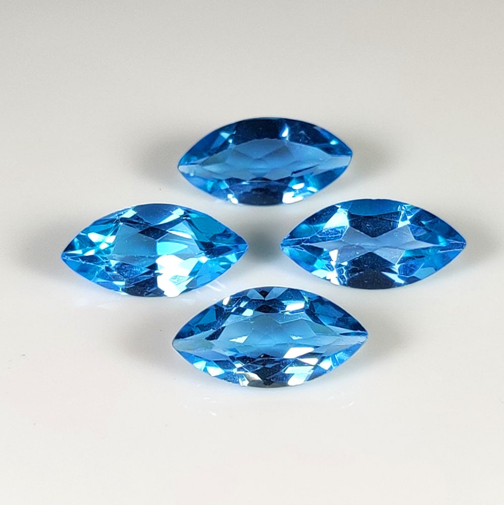 7.80 Ct Natural Blue Topaz Marquise Cut Set: Weight - 7.80 Ct / Dimensions - 12.0x6.0 - 12.2x6.1 mm / 4 Pc's / Shape & Cut - Marquise Cut / Color - Blue / Transparency - VVS / Origin - Brazil / Comments - Irradiated
