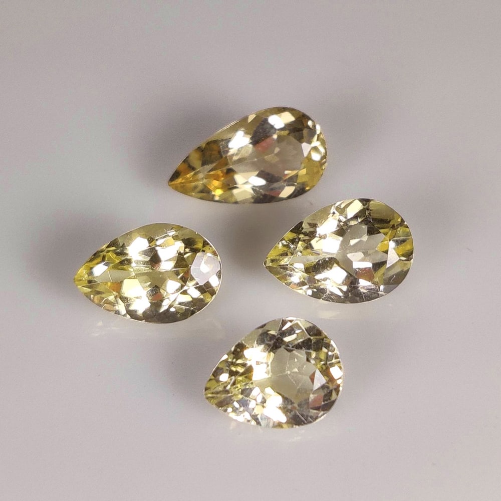 5.94 Ct Natural Yellow Beryl Pear Cut: Weight : 5.94 Ct / Dimensions : 8.3x6.5 - 11.8x6.2 mm / 4 Pc's / Shape : Pear Cut / Color : Yellow / Transparency : Transparent / Treatment : Heated