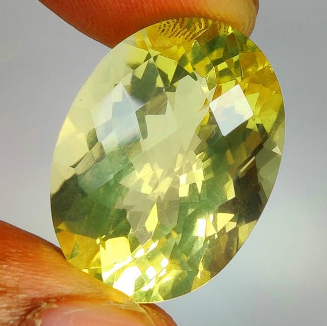 22.35 Ct Natural Lemon Quartz OVal Cut: Weight - 22.35 Ct / Dimensions - 22.00 x 16.10 x 12.20 mm / Top Quality Luster / Excellent OVal Cut / Origin - Brazil / Comments - Heated