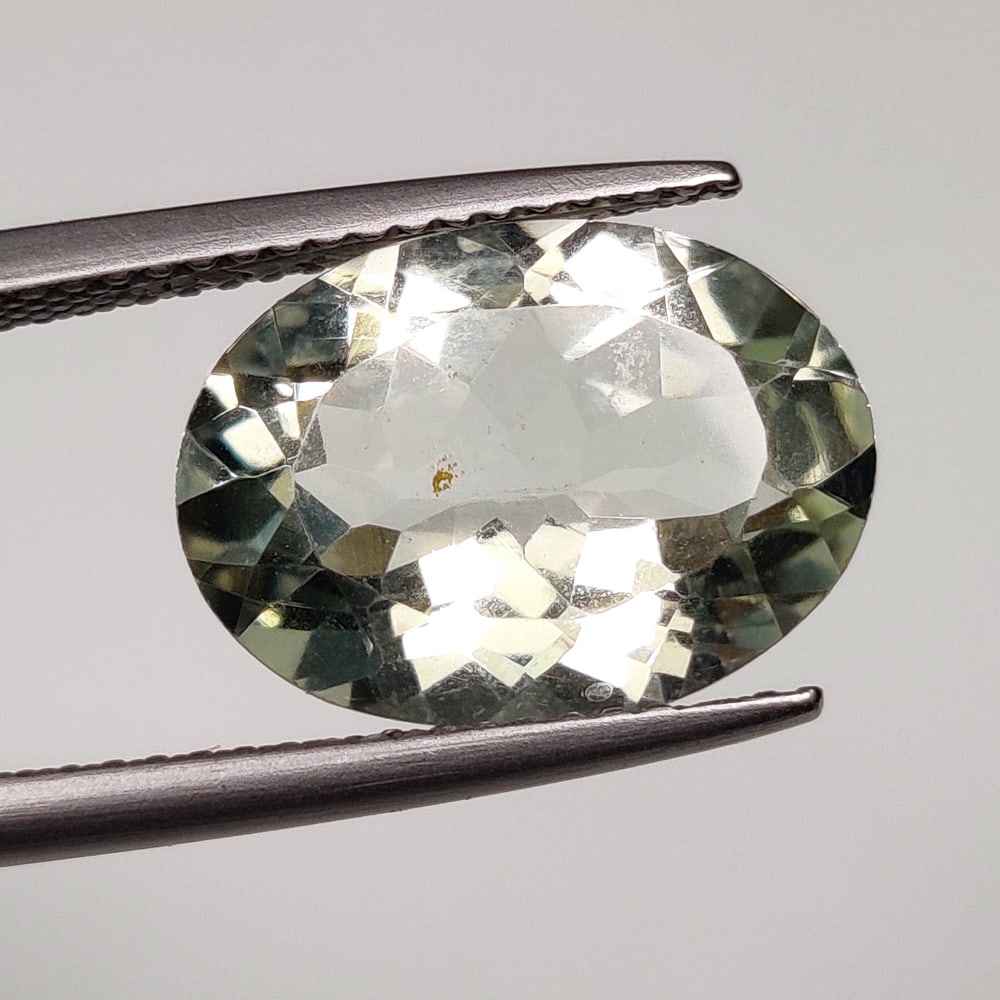 4.83 Ct Natural Green Amethyst Oval Cut: Weight - 4.83 Ct / Size - 14.30 x 10.40 x 6.50 mm / Shape - Oval Cut / Color - Green / Clarity - VVS / Origin - Brazil / Treatment - Heated