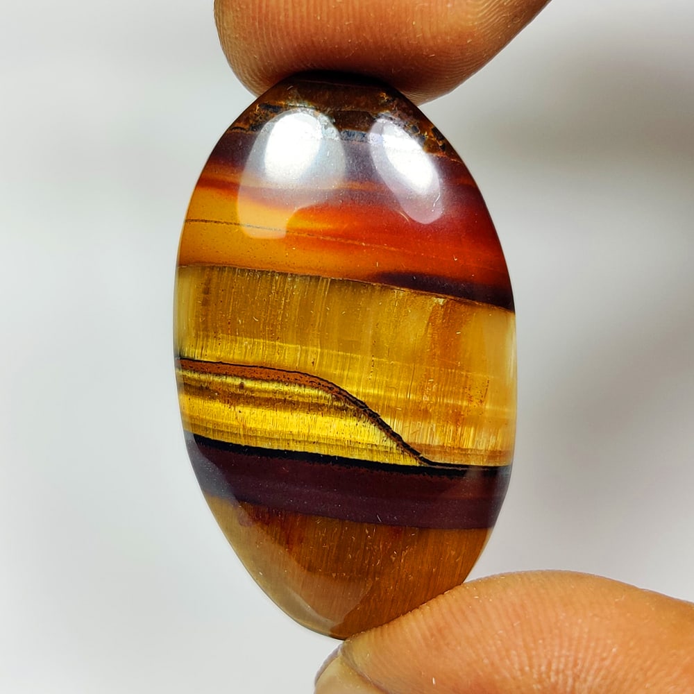 36.50 Ct Natural Tiger Eye Oval Cab (1 of 2)