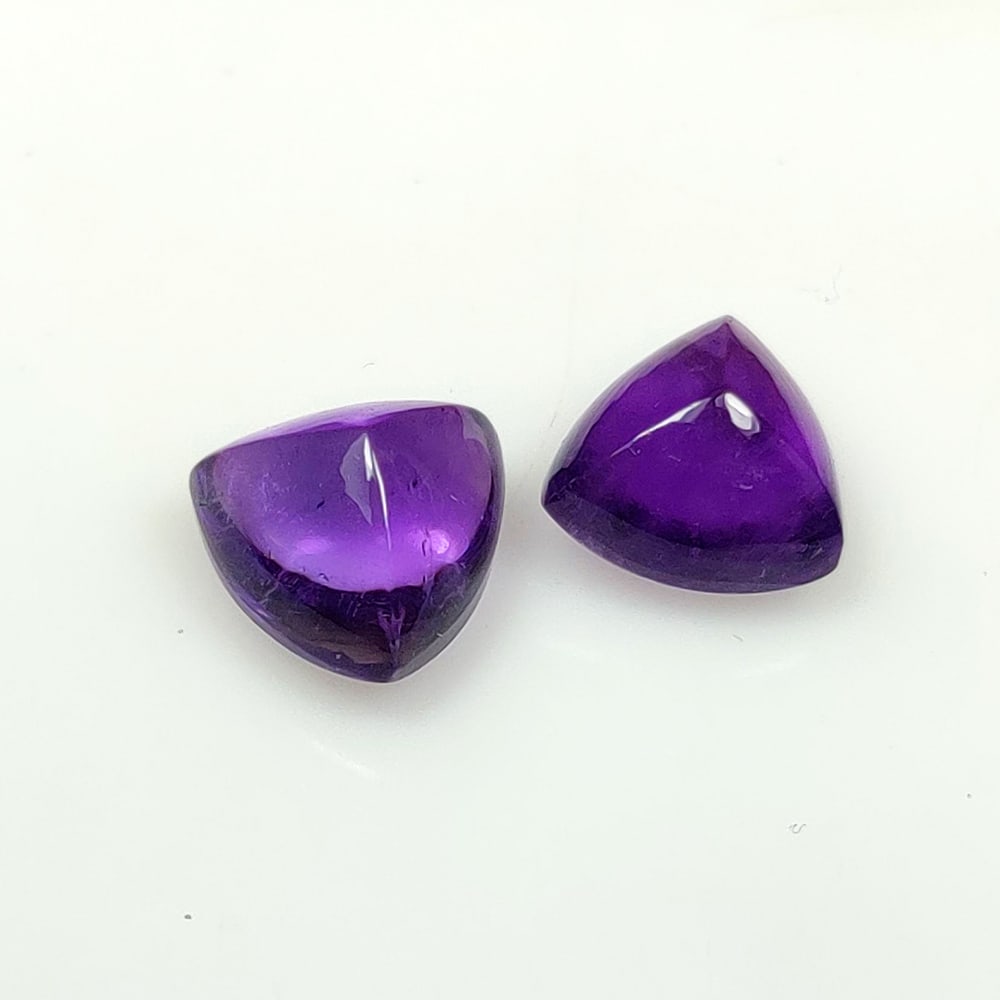 4.20 Ct Natural Purple Amethyst Trillion Sugar Loupe Pair: Weight - 4.20 Ct / Dimensions - 8.10 x 8.00 x 6.10 mm / 2 Pc's / Shape - Trillion Cab / Color - Purple / Clarity - Transparent / Origin - Brazil / Treatment - Heated