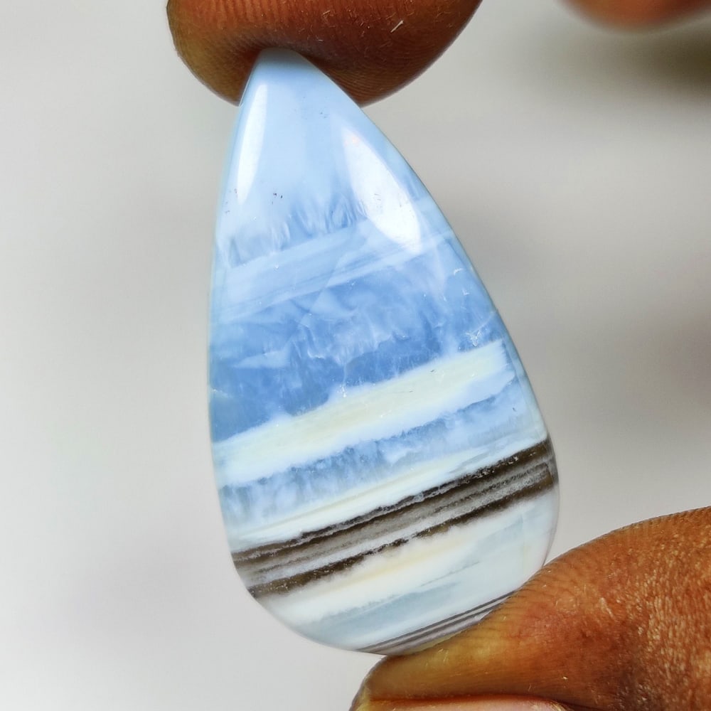 20.79 Ct Natural Owyhee Blue Opal Pear Cab (1 of 2)