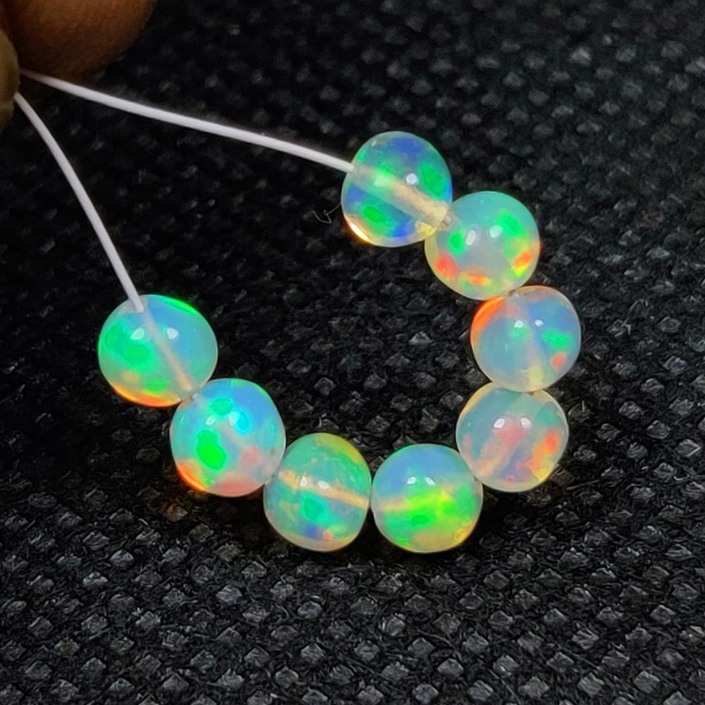 2.39 Ct Natural Multicolor Welo Opal Flash Fire Round Beads (1 of 2)