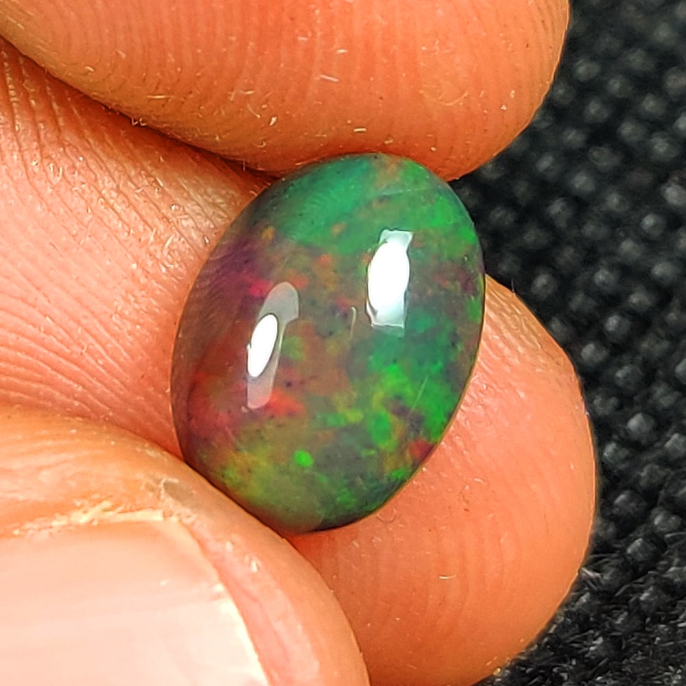 1.77 Ct Natural Black Flashing Fire Opal Oval Cab (1 of 3)