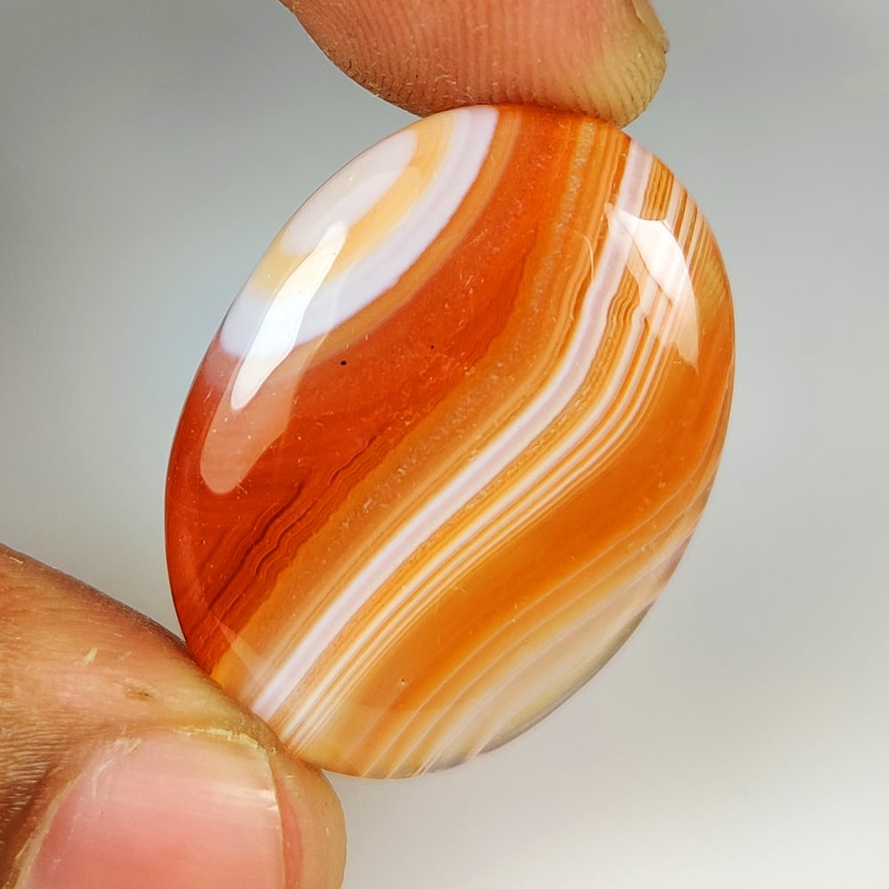 31.65 Ct Natural Orange Botswana Agate Oval Cab (1 of 2)