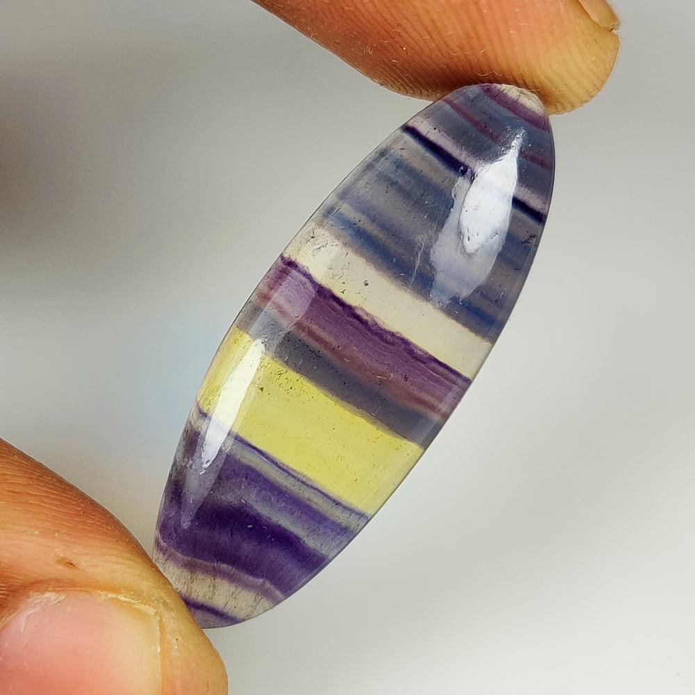 29.46 Ct Natural Multicolor Fluorite Oval Cab (1 of 2)