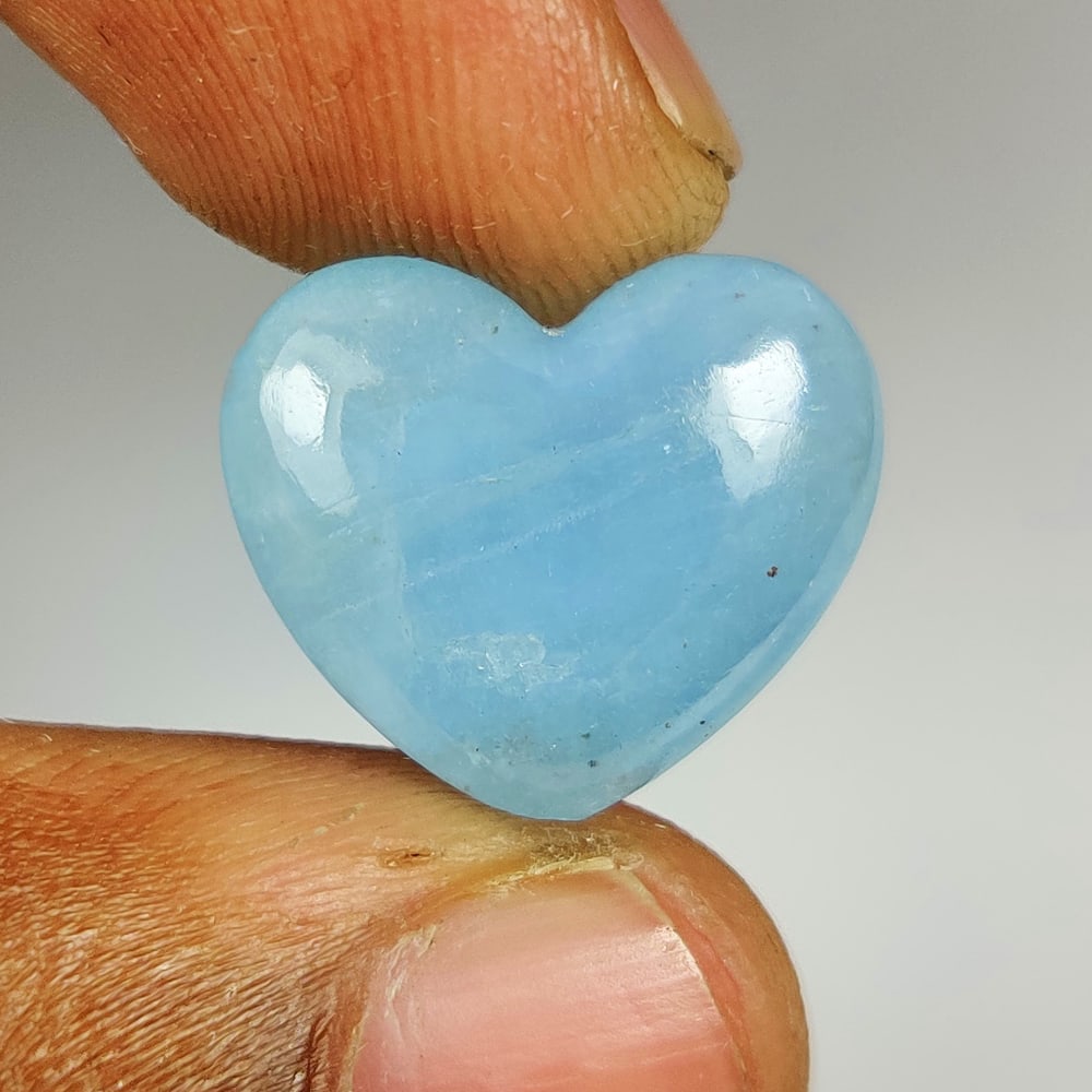 11.71 Ct Natural Blue Aquamarine Heart Cab: Weight - 11.71 Ct / Dimensions -17.30 x 15.00 x 6.60 mm / Shape - Heart Cab / Color - Blue / Clarity - SI / Origin -India / Treatment - Commonly Heated