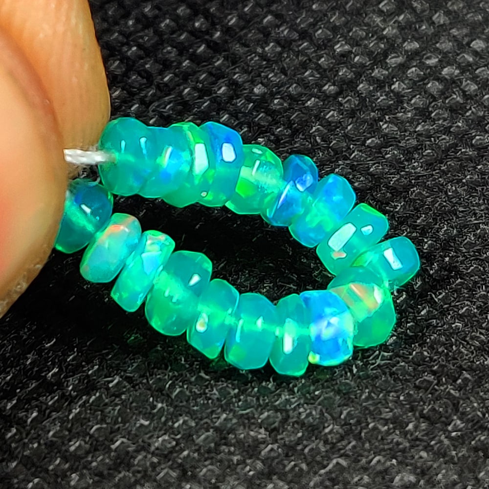 2.43 Ct Natural Green Fire Opal Drilled Beads: Weight - 2.43 Ct / Dimensions - 3.80 - 4.00 mm / 18 Pc's / Shape - Round Beads / Color - Green / Clarity - Transparent / Origin - Ethiopia / Treatment - Heated