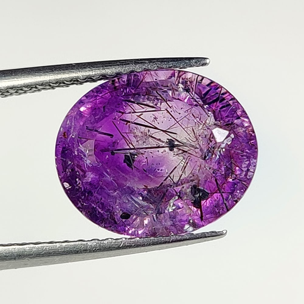 4.84 Ct Natural Purple Rutile Amethyst-Quartz Oval Cut: Weight - 4.84 Ct / Dimensions - 12.00 x 10.10 x 7.20 mm / Shape & Cut - Oval Cut / Transparency - Transaprent / Origin - India / Comments - None