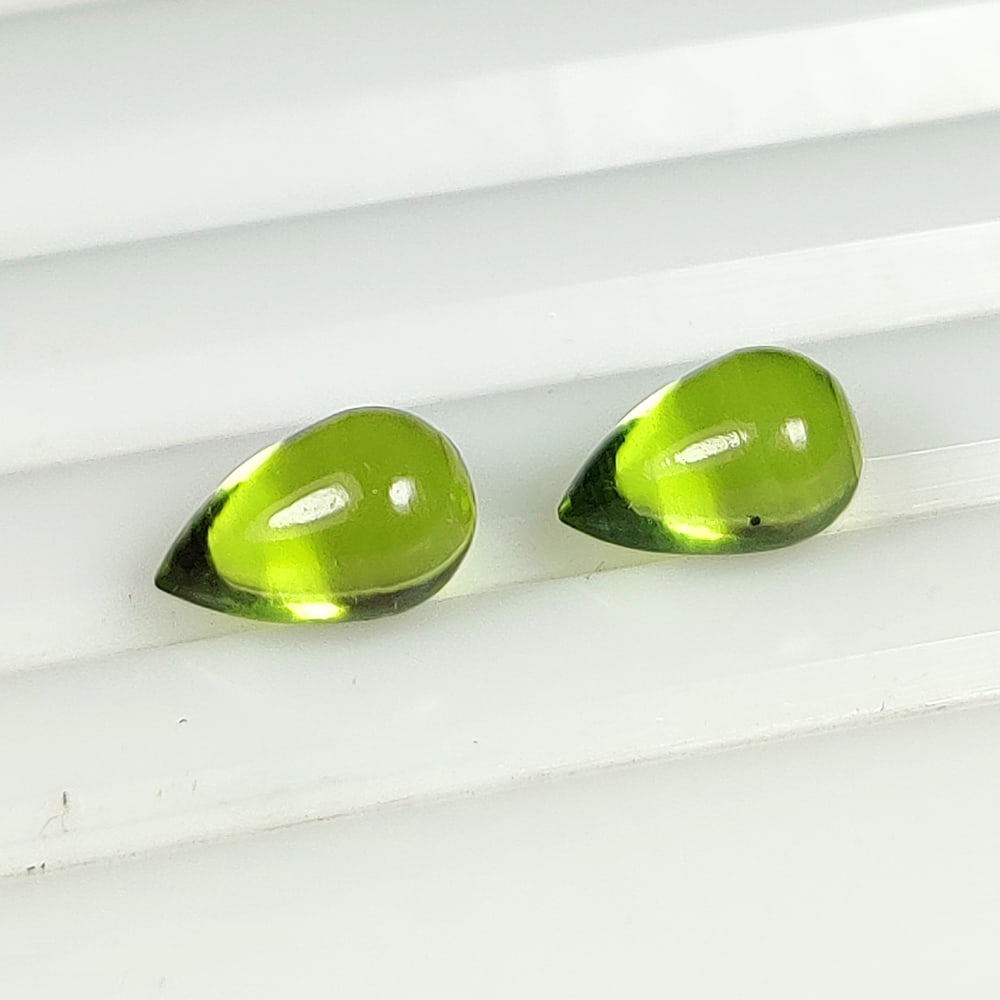 3.25 Ct Natural Green Peridot Pear Drop Pair: Weight - 3.25 Ct / Dimensions - 8.20 x 8.20 x 5.20 mm / 2 Pc's / Shape - Pear Drop Beads / Color - Green / Clarity - VVS / Origin - Pakistan / Treatment - None