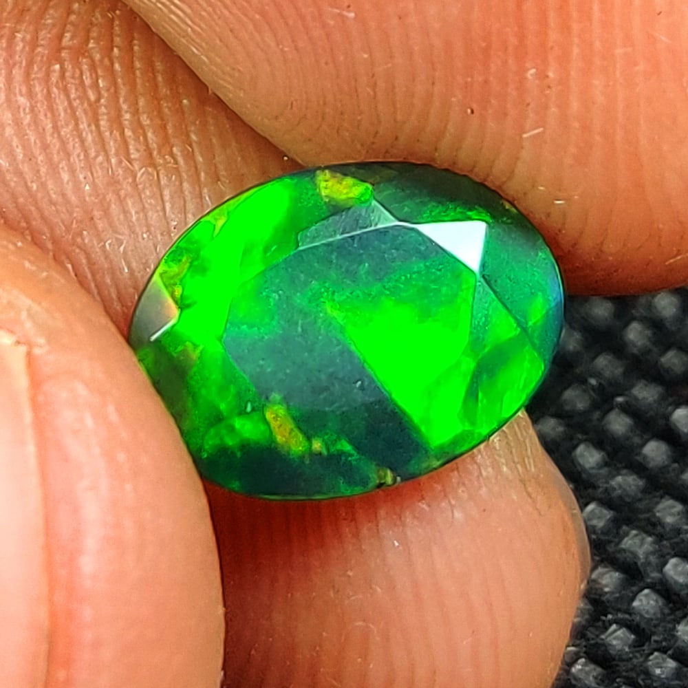 1.21 Ct Natural Black Flashing Fire Opal Oval Cut (1 of 3)