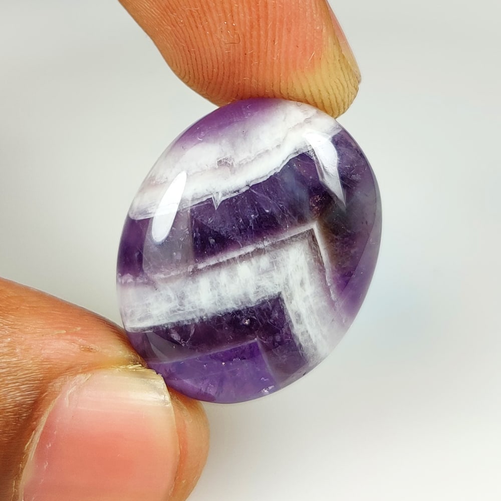 27.81 Ct Natural Chevron Amethyst Oval Cab (1 of 2)