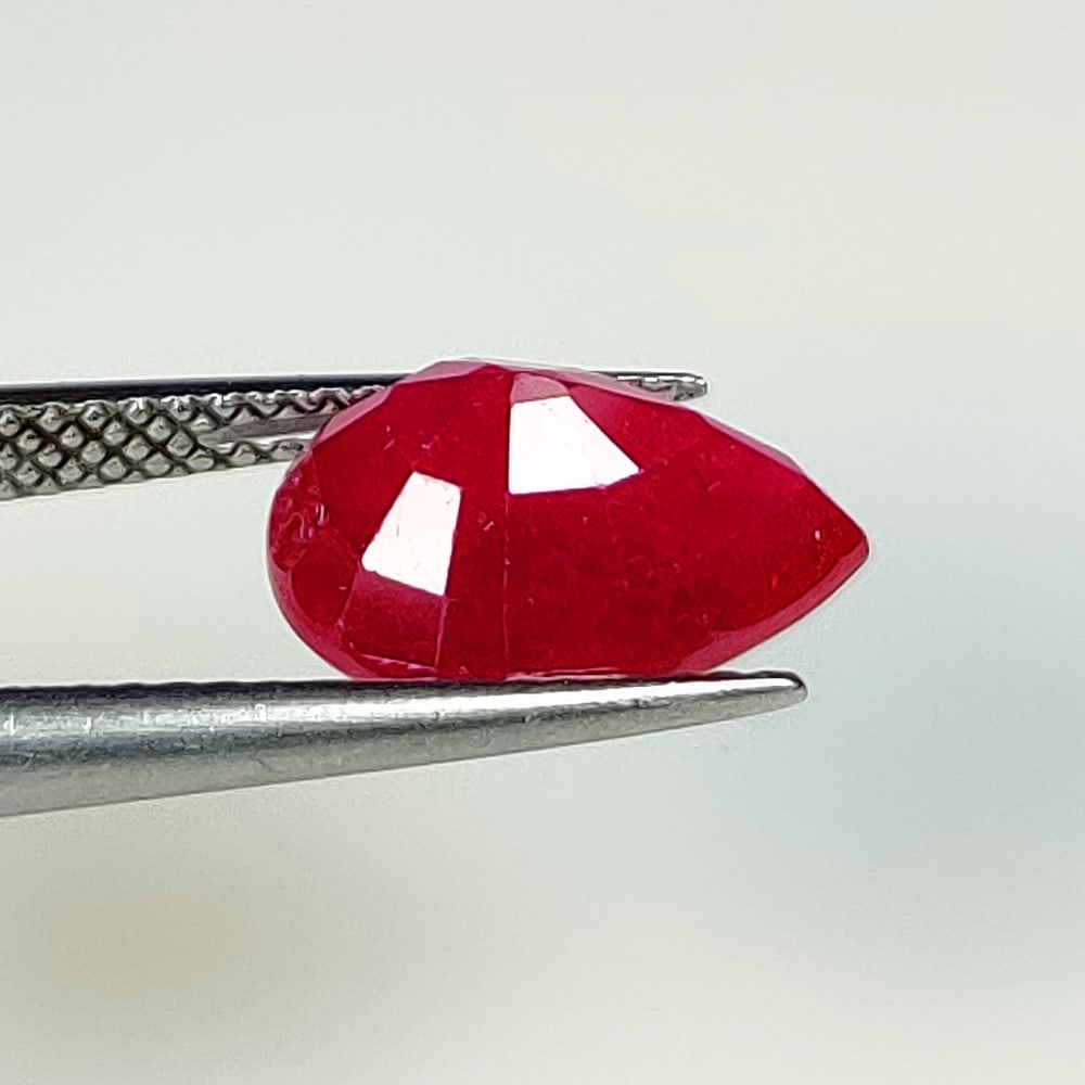 4.60 Ct Natural Blood Red Ruby Pear Cut: Weight - 4.60 Ct / Dimensions - 11.70 x 8.80 x 5.80 mm / Shape - Pear Cut / Color - Red / Clarity - SI / Origin - Mozambique / Treatment - Color Enhanced by Glass Filling