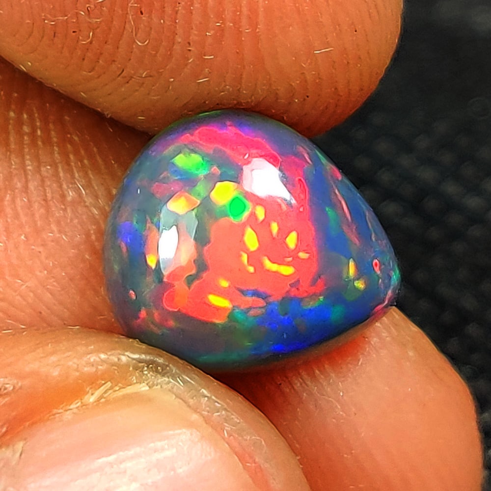 2.18 Ct Natural Black Flashing Fire Opal Pear Cab (1 of 3)