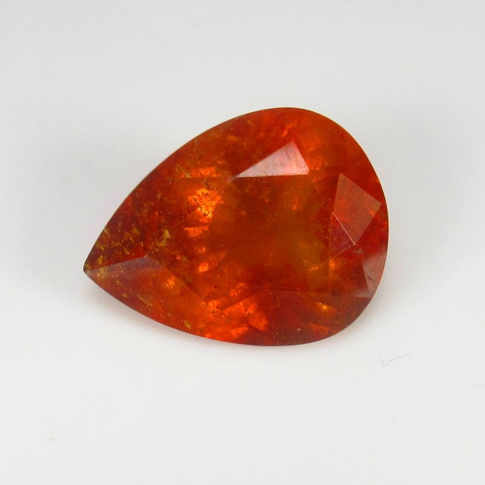 13.50 Ct Natural Orange Spessarite Garnet Pear Cut: Weight - 13.50 Ct / Dimensions - 18.70 x 14.30 x 8.80 mm / Shape - Pear Cut / Clarity - SI / Origin - Madagascar / Comments - None