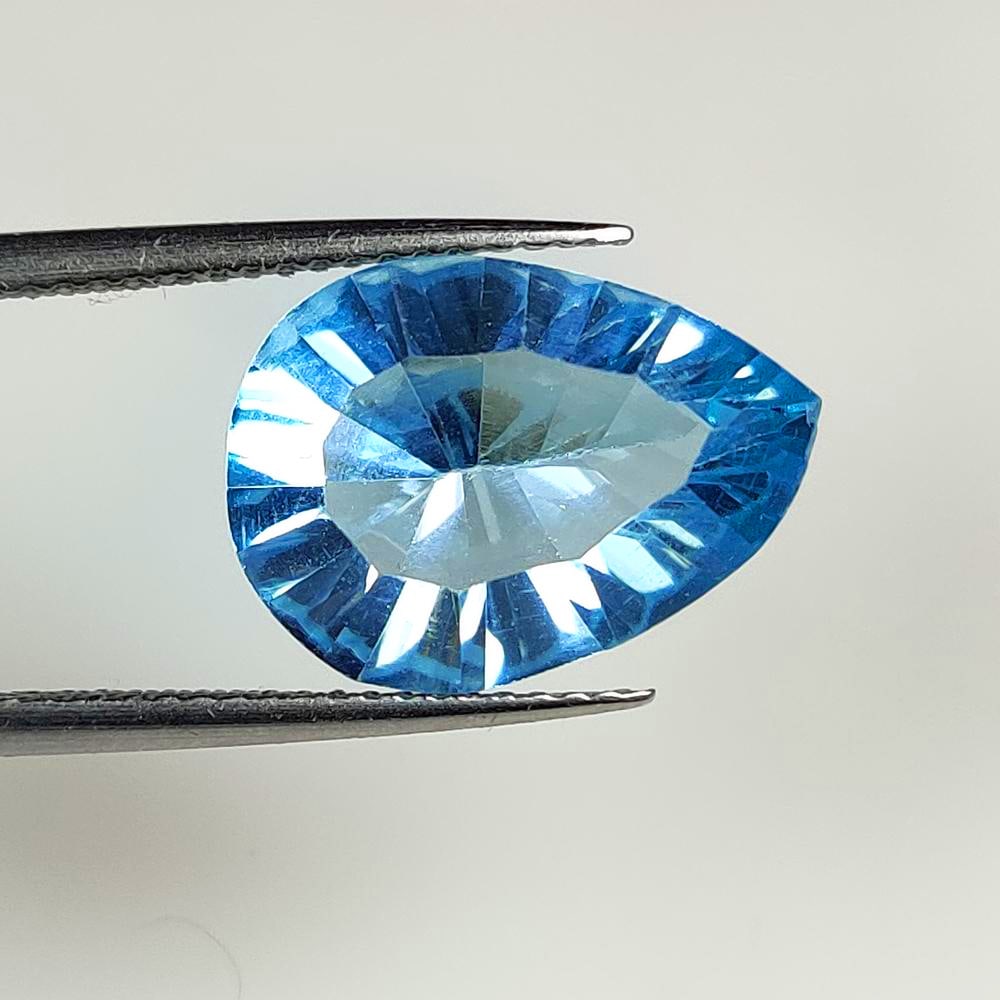 8.07 Ct Natural London Blue Topaz Pear Concave Cut: Weight : 8.07 Ct / Dimensions : 15.30 x 11.10 x 7.10 mm / Shape : Pear Cut / Color : Blue / Transparency : VVS / Treatment : Irradiated