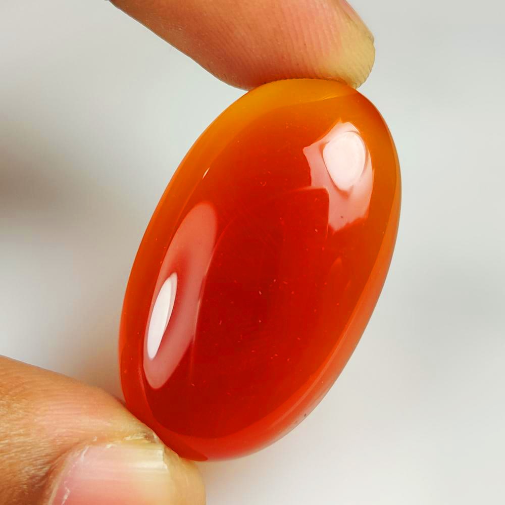 43.85 Ct Natural Deep Orange Onyx Oval Cab: Weight - 43.85 Ct / Dimensions - 39.00 x 23.00 x 6.70 mm / Shape - Oval Cab / Clarity - Opaque / Origin - Brazil / Comments - None