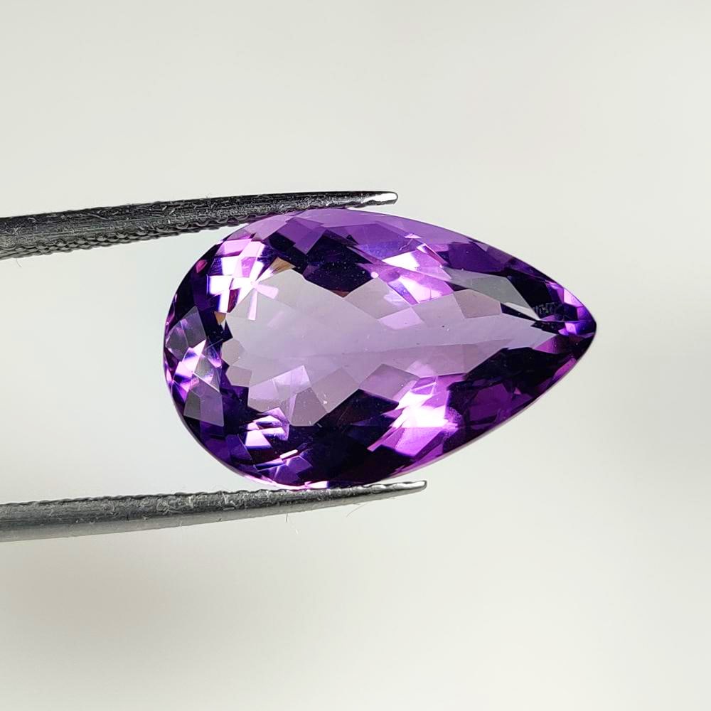 9.44 Ct Natural Purple Amethyst Pear Cut: Weight - 9.44 Ct / Dimensions - 18.50 x 12.10 x 7.70 mm / Shape - Pear Cut / Color - Purple / Clarity - VVS / Origin -Brazil / Treatment - Heated