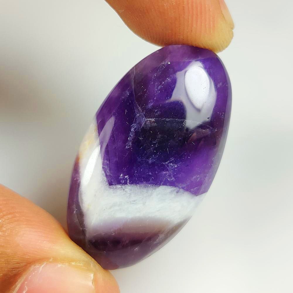 37.54 Ct Natural Chevron Amethyst Oval Cab: Weight - 37.54 Ct / Dimensions - 36.00 x 19.00 x 7.10 mm / Shape - Oval Cab / Clarity - Opaque / Origin - Brazil / Treatment - None