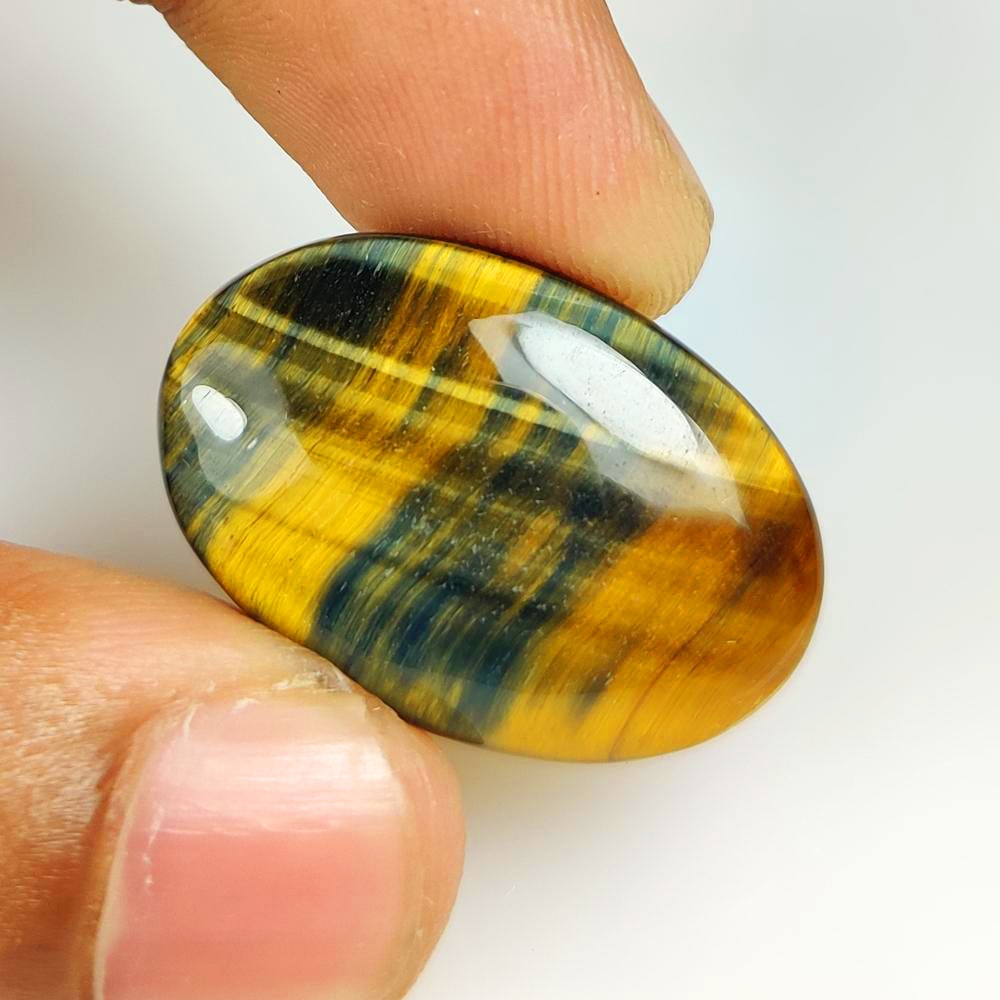 22.47 Ct Natural Tiger Eye Oval Cab: Weight - 22.47 Ct / Dimensions - 28.00 x 18.40 x 5.40 mm / Top Class Quality / Oval Cab / Origin - Burmese / Comments - None