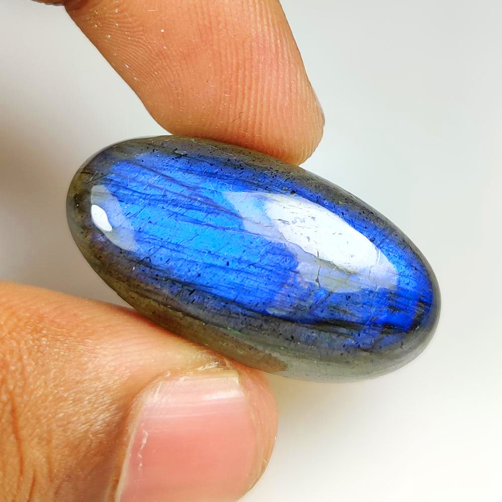 43.40 Ct Natural Flashing Labradorite Oval Cab: Weight - 43.40 Ct / Dimensions - 34.00 x 17.20 x 9.00 mm / Shape - Excellent Oval Cab / Clarity - Opaque / Origin - Africa / Treatment - None