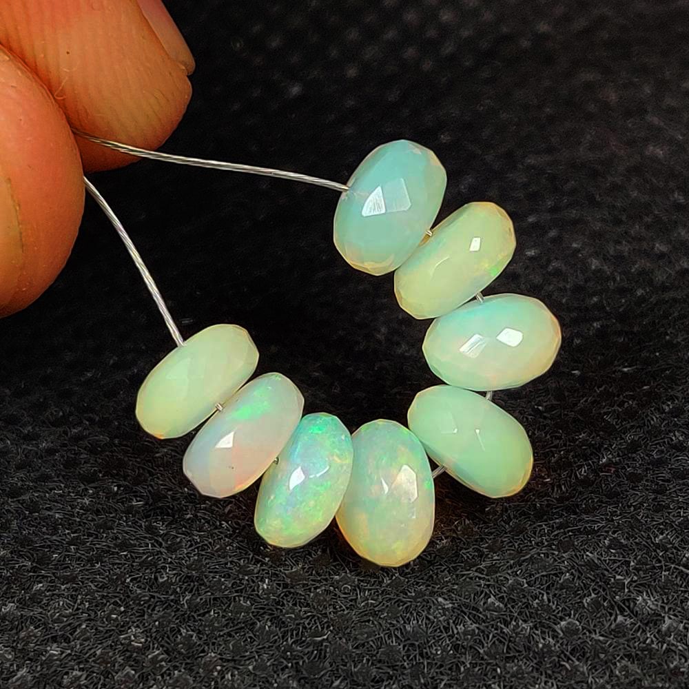 7.20 Ct Natural Multicolor FIre Opal Round Faceted Beads: Weight - 7.20 Ct / Dimensions - 6.70 - 6.90 mm / 8 Pc's / Shape & Cut - Drilled Round Beads / Color - Pink & Blue / Transparency - Translucent / Origin - Ethiopia / Comments - None