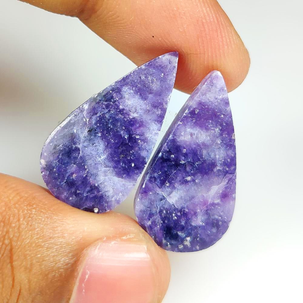 24.02 Ct Natural Purple Lepidolite Oval Pair: Weight - 24.02 Ct / Dimensions - 27.00 x 13.80 x 4.10 mm / 2 Pc's / Shape - Oval Cab / Color - Purple / Clarity - Transparent / Origin - Brazil / Treatment - None
