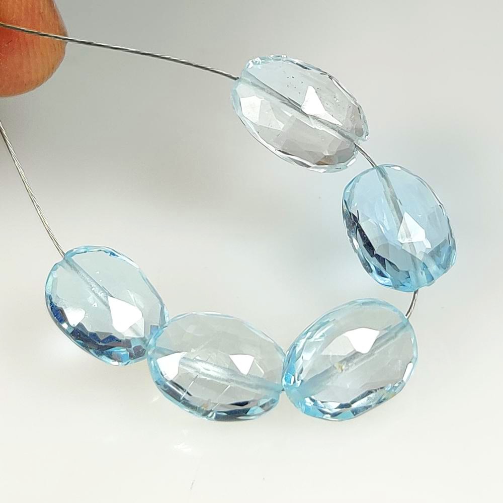 15.40 Ct Natural Blue Topaz Oval Checkerboard Beads: Weight - 15.40 Ct / Dimensions - 9.80 x 7.30 - 10.50 x 7.60 mm / 5 Pc's / Shape - Checkerboard Beads / Color - Blue / Clarity - VVS / Origin - Brazil / Treatment - Irradiated