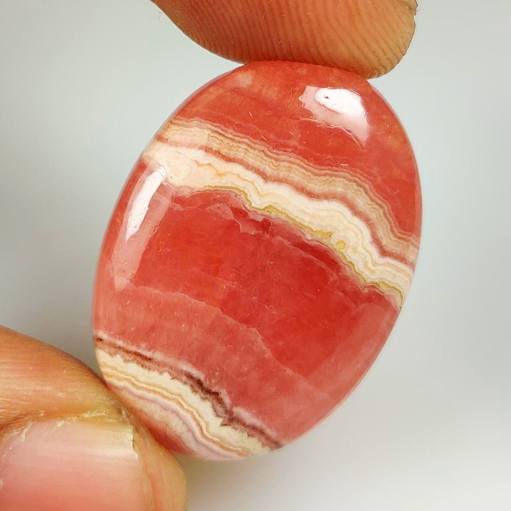 35.13 Ct Natural Rhodochrosite Oval Cab: Weight - 35.13 Ct / Dimensions - 28.00 x 20.20 x 5.50 mm / Shape - Oval Cab / Clarity - Opaque / Origin - Brazil / Treatment - None