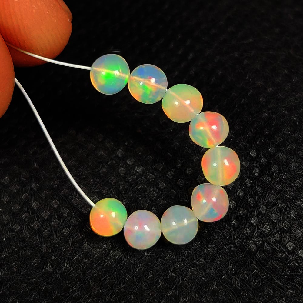 3.71 Ct Natural Multicolor Welo Opal Flash Fire Round Ball Beads: Weight - 3.71 Ct / Dimensions - 4.30 - 4.60 mm / 9 Pc's / Shape & Cut - Round Ball Beads / Color - Multicolor / Transparency - Translucent / Origin - Ethiopia / Comments - None