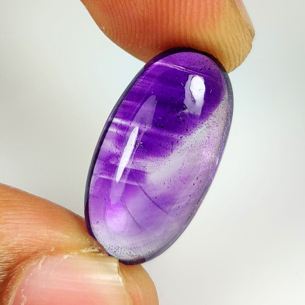 11.30 Ct Natural Purple Amethyst Oval Cab: Weight - 11.30 Ct / Dimensions - 23.00 x 11.30 x 6.60 mm / Shape - Oval Cab / Color - Purple / Clarity - Transparent / Origin -Brazil / Treatment - Heated