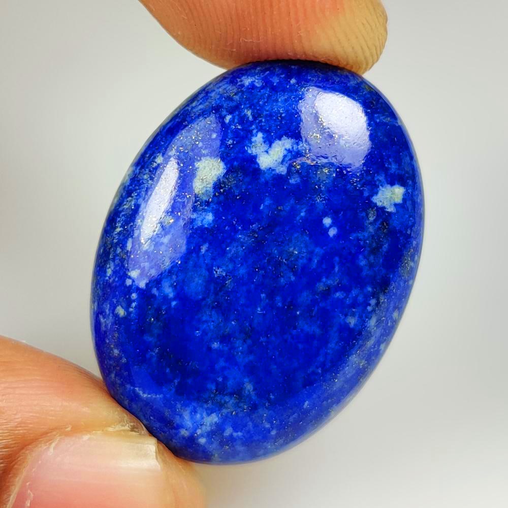 31.62 Ct Natural Blue Lapis Lazuli Oval Cab: Weight - 31.62 Ct / Dimensions - 31.00 x 22.00 x 6.10 mm / Shape - Oval Cab / Clarity - Opaque / Origin - Afghanisthan / Treatment - None