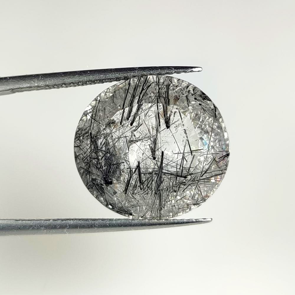 15.23 Ct Natural Black Lined Rutile Quartz Oval Cut: Weight - 15.23 Ct / Dimensions - 16.00 x 15.00 x 10.50 mm / Shape - Oval Cut / Clarity - Transaprent / Origin - India / Treatment - None