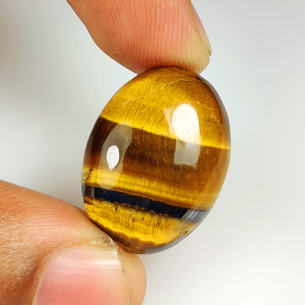 23.84 Ct Natural Tiger Eye Oval Cab: Weight - 23.84 Ct / Dimensions - 25.00 x 17.90 x 6.80 mm / Top Class Quality / Oval Cab / Origin - Burmese / Comments - None