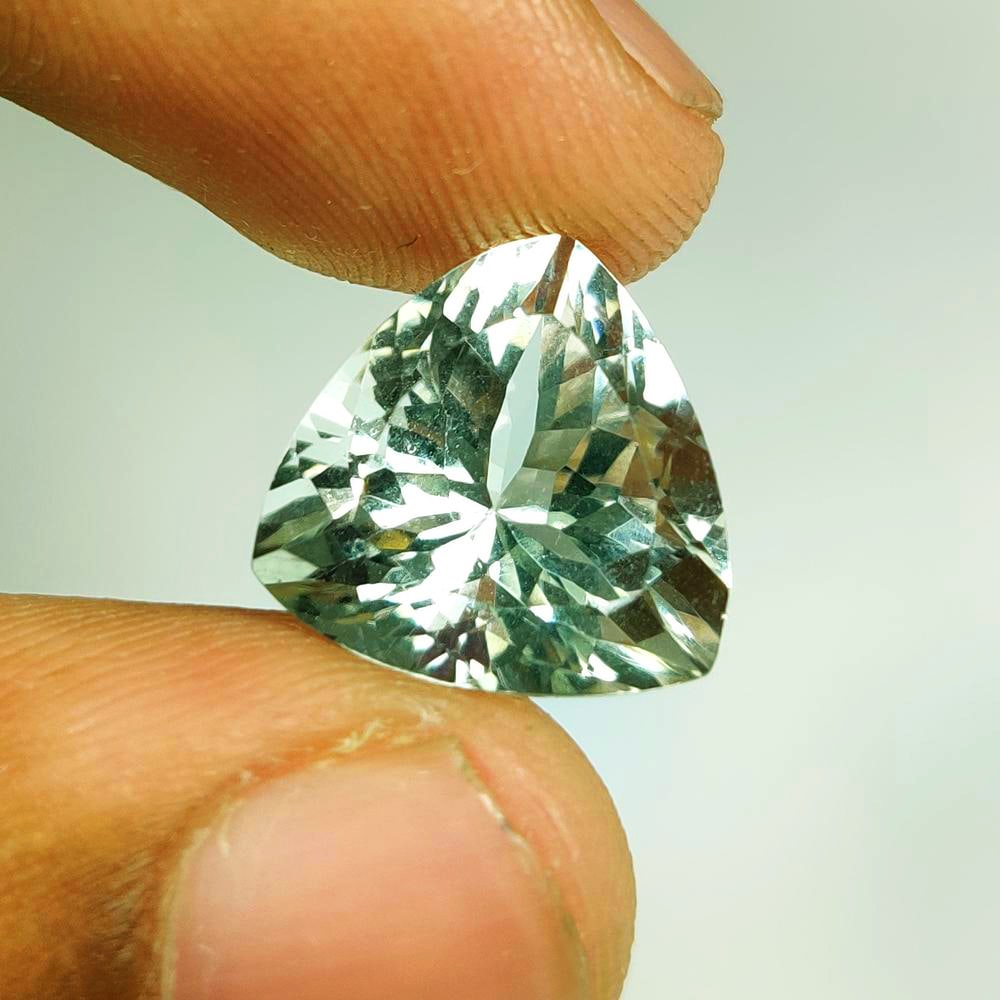 8.85 Ct Natural "Prasiolite" (Green Amethyst)Trillion Cut: Weight - 8.85 Ct / Dimensions - 14.00 x 14.00 x 9.70 mm / Shape - Trillion Cut / Color - Green / Clarity - VVS / Origin - Brazil / Treatment - Heated