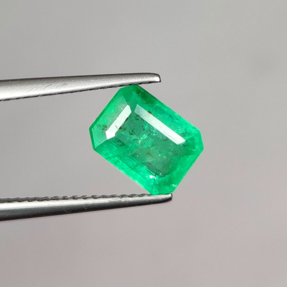 2.07 Ct Natural Zambian Apple Green Emerald Octagon Cut: Weight - 2.07 Ct / Dimensions - 8.90 x 6.70 x 4.10 mm/ Shape - Octagon Cut / Color - Green / Clarity - SI / Origin - Zambia / Treatment - Natural Emeralds are commonly enhanced by oil
