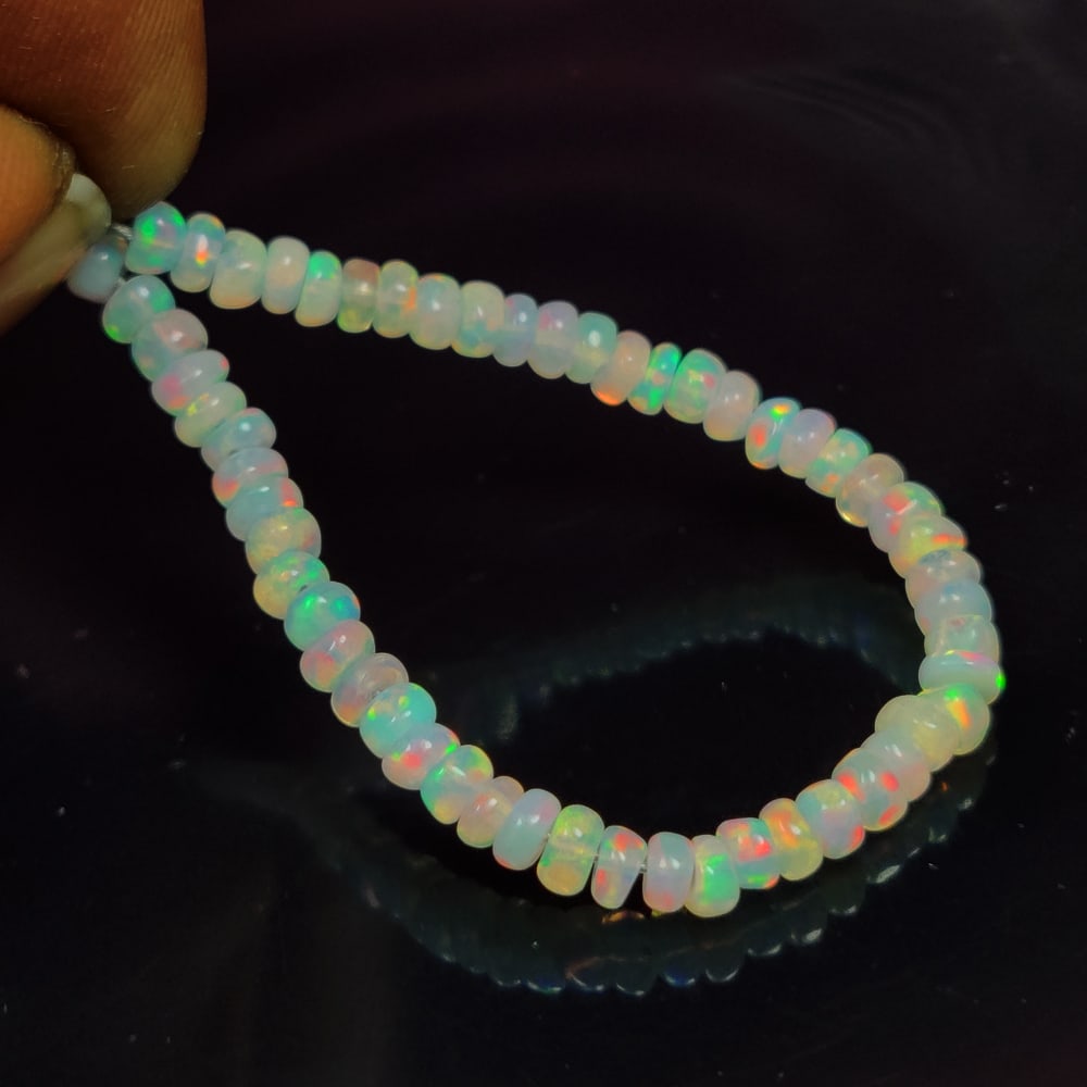 5.66 Ct Natural Multi-Color Welo Opal Round Beads: Weight - 5.66 Ct / Size - 3.20 - 3.40 mm / 55 Pc's / Shape - Round Beads / Color - Multicolor / Clarity - Translucent / Origin - Ethiopia / Treatment - None