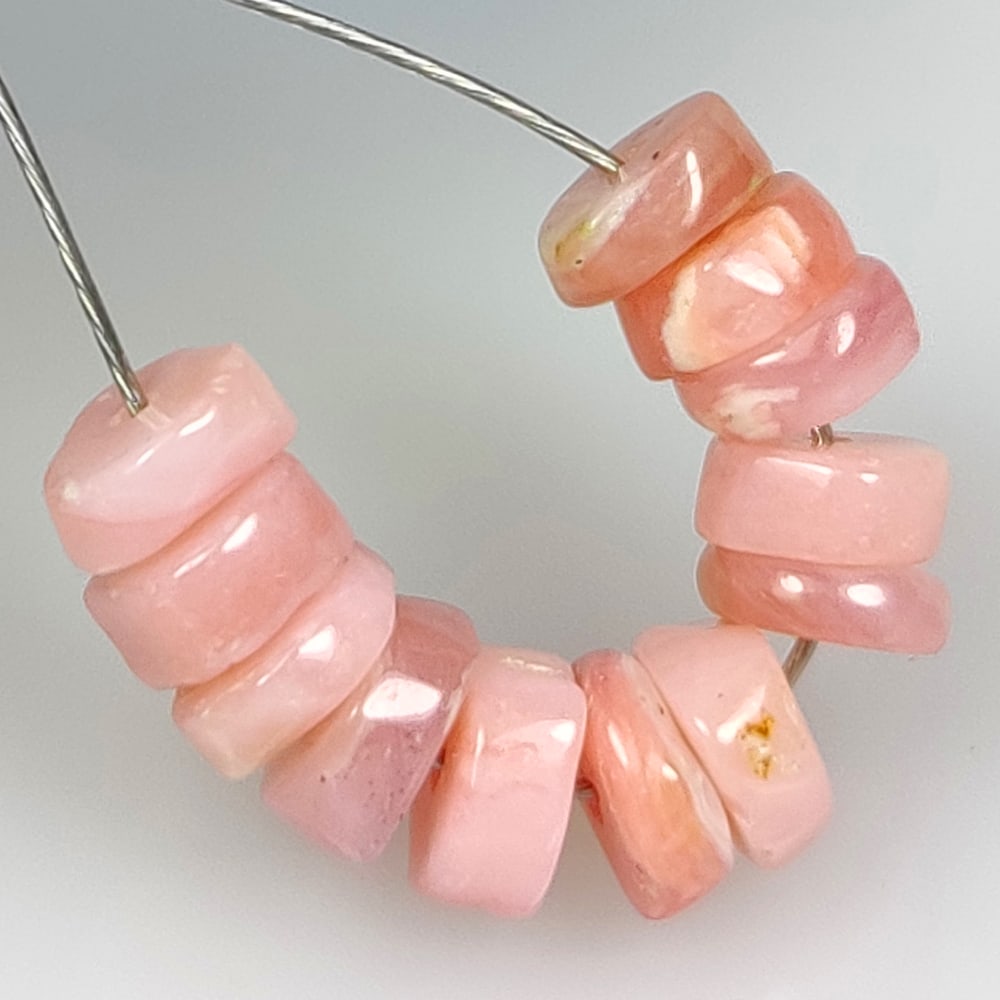 6.42 Ct Natural Pink Opal Round Beads: Weight - 6.42 Ct / Dimensions - 5.20 - 5.90 mm / 12 Pc's / Shape - Round Beads / Clarity - Opaque / Origin - Peru / Comments - Color Coated