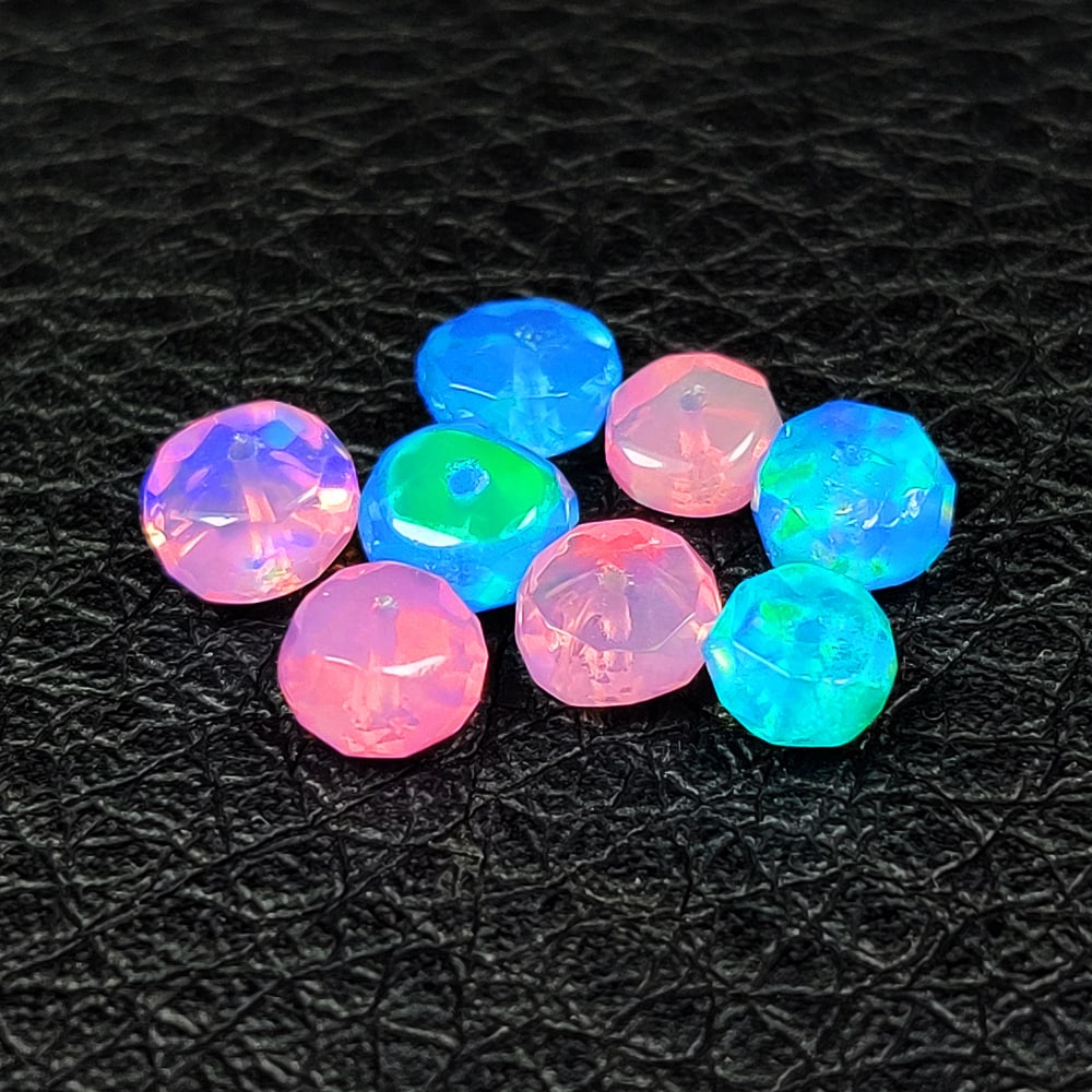 3.14 Ct Natural Blue & Pink Opal Faceted Beads: Weight - 3.14 Ct / Dimensions - 5.00 - 5.20 mm / 8 Pc's / Shape - Round Drilled / Color - Pink & Blue / Clarity - Translucent / Origin - Ethiopia / Treatment - Heated
