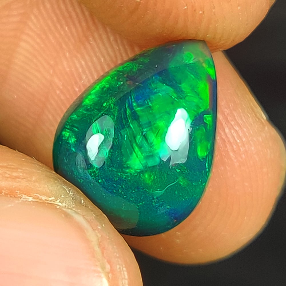3.69 Ct Natural Black Flashing Fire Opal Pear Cab (1 of 2)