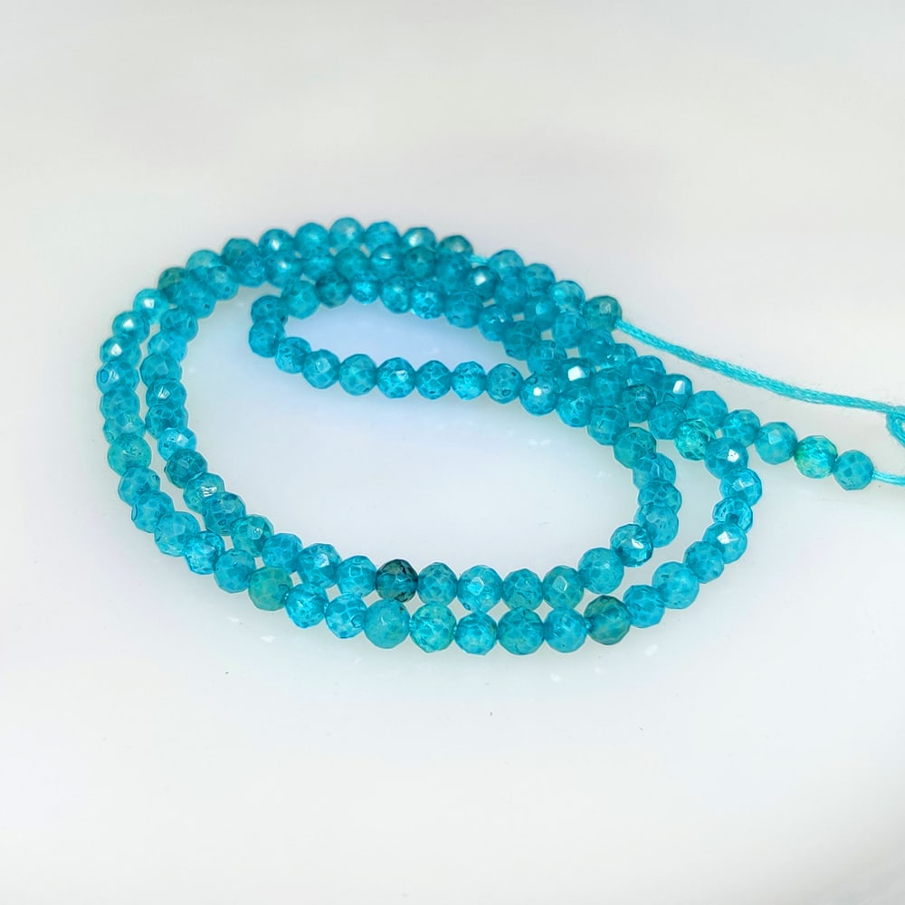 19.54 Ct Natural Neon Blue Apatite Round Drilled Beads (1 of 2)